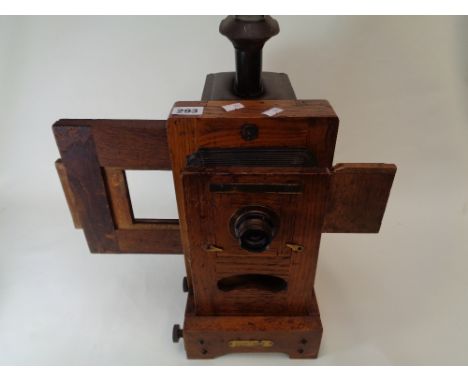 The Cornet 1916 Patent concertina Magic Lantern with oak frame          