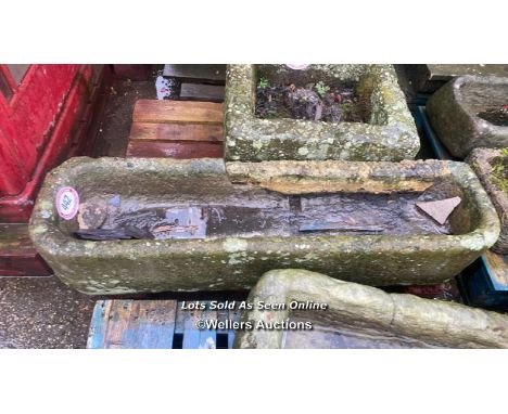 A NARROW STONE TROUGH, 138CM (L) X 37CM (W) X 27CM (D)