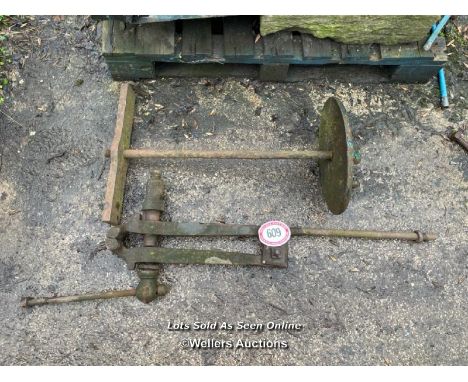 A HEAVY DUTY LEG VICE AND ONE OTHER ITEM