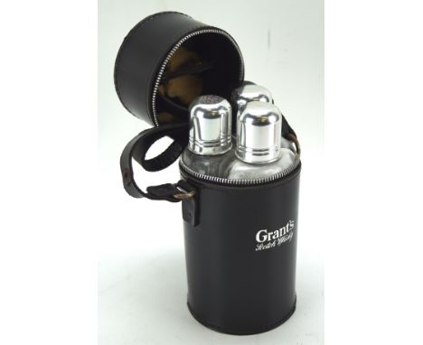 A vintage Grants scotch whisky three bottle travelling set, 19cm high
