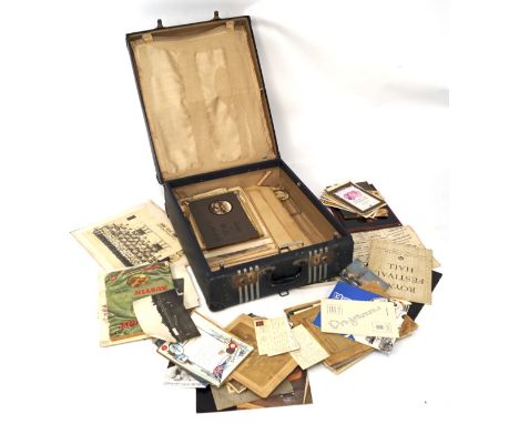 A silk lined vintage traveling case, with the original travelling labels, containing an assortment of mixed ephemera, includi