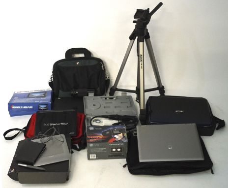 A collection of laptops, camera lenses and electronic devices, including an Acer laptop, a tripod, Canon 70-210mm lens and mo