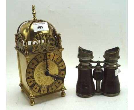 A Smiths Industries brass lantern clock, height 24cm, and a pair of leather bound vintage binoculars