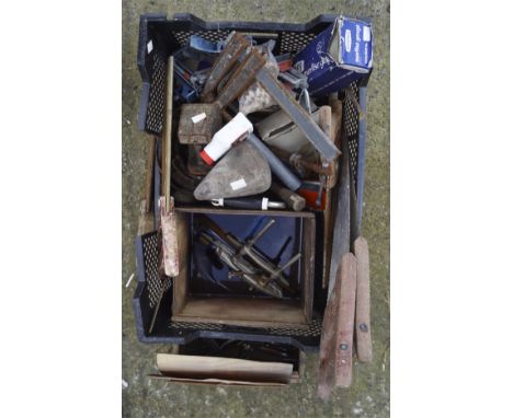 A collection of vintage tools, including saws, wrenches, clamps and more