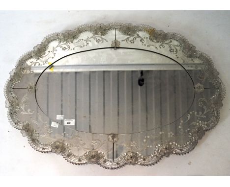 A contemporary wall mirror, of oval form, the frame featuring raised glasswork and floral decoration, height, 61cm x 85cm Con