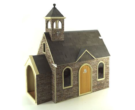 A vintage dolls house in the form of a church, with fitted interior, approximately 62cm high