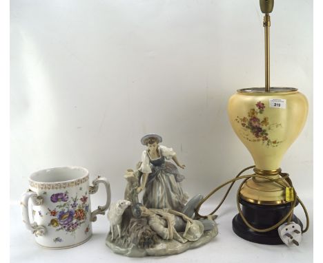 Three items of 20th century ceramics, including a Lladro figure of a man and woman, a Worcester lamp base decorated with flow