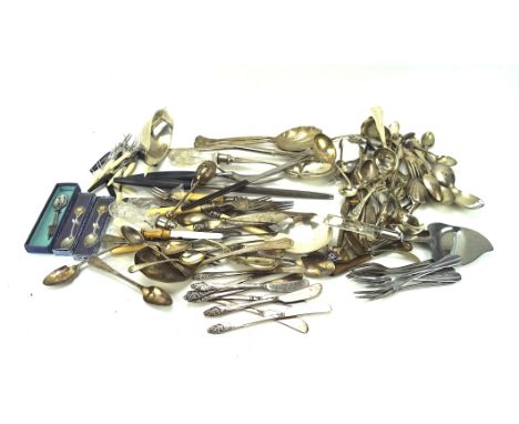 A quantity of silver plated flatware, including spoons, a serving ladle and more