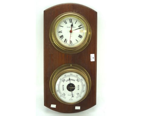 A 20th century Foster Gallear wall barometer and clock, each housed in brass cases, mounted on wooden plaque, 58cm long