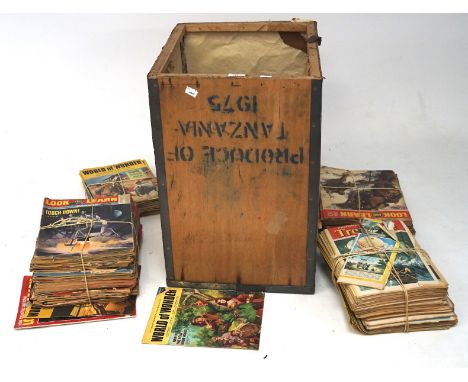 A large collection of vintage comics, comprising mostly Playhour, in a wooden crate