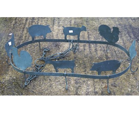 A vintage cast metal ceiling hanger, featuring the profiles of farm animals, 75cm x 36cm