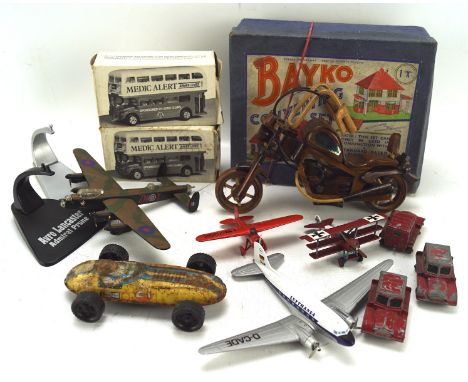 A collection of toys, including model planes, a boxed Bayko Building Set, Matchbox diecast vehicles and more