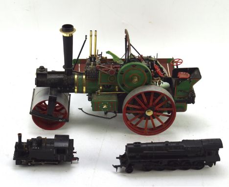 A contemporary scratch built model of a steam traction engine, 31cm long, together with other models