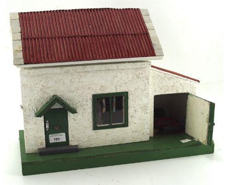 A small vintage dolls house, with partially fitted interior, 35cm high