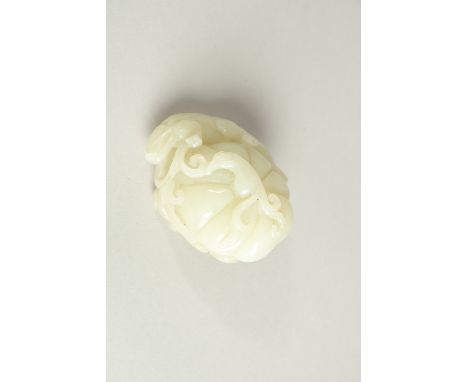 A CHINESE CELADON JADE CARVING OF A PUMPKIN AND CHILONG, 6cm wide, 3.5cm thick.