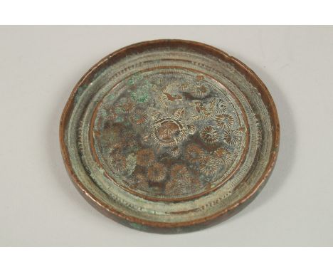 A CHINESE CIRCULAR BRONZE MIRROR, 8.5cm diameter.