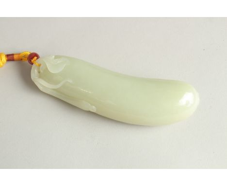 A CHINESE CELADON JADE CARVING OF A CUCUMBER, 13.5cm long.