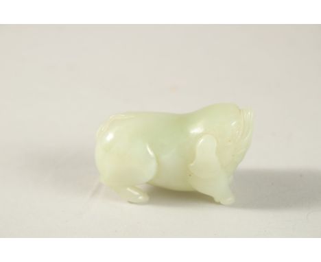 A CHINESE JADE CARVING OF A PIG, 5cm long.