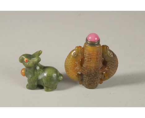 A FINE CHINESE CARVED JADE RABBIT FORMED SNUFF BOTTLE, together with a carved jade snuff bottle with fish designs, (2).