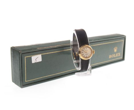 LADY'S ROLEX GOLD MANUAL WIND WRIST WATCH, 1960s, the round white dial with applied hexagonal baton hour markers, gold hands,