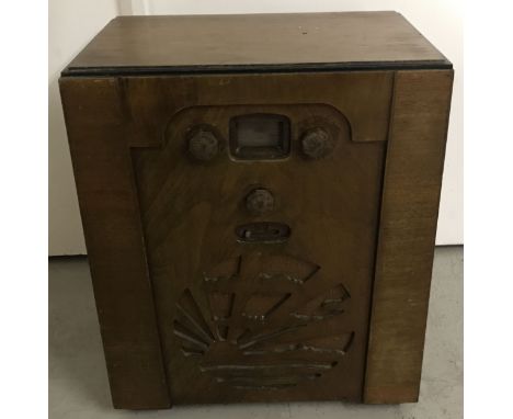 A vintage wooden cased radio with iconic sunray design front speaker.  Approx. 41 x 23 x 50cm.