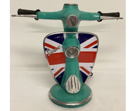 A novelty table lamp in the shape of the handlebars of a Vespa scooter, with Union Jack design. With moving brake levers and 