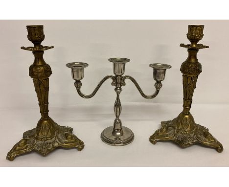 A pair of brass Italian rococo style candle sticks together with a vintage silver plate candelabra.  Candle stick approx. 25c