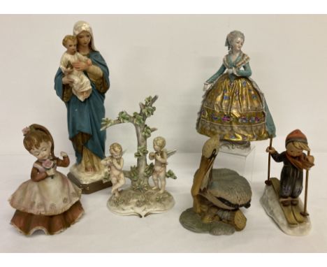 A collection of vintage ceramic figurines to include Dresden and Goebel Hummel.  