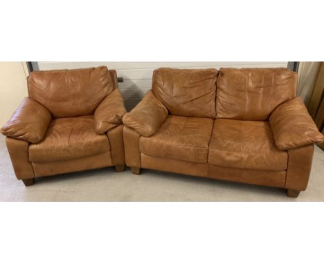 A modern design 2 seater tan leather sofa and matching armchair with square wooden feet Fire labels to underside. Sofa approx