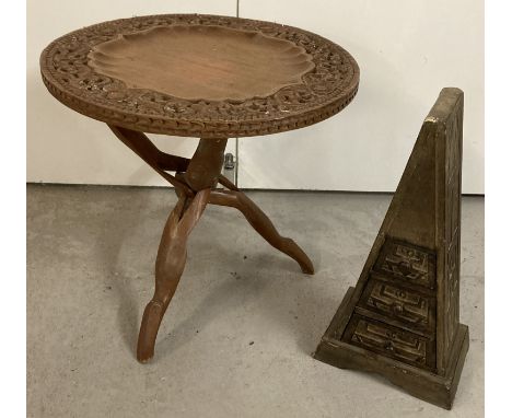 2 vintage ethnic wooden pieces of small furniture. A folding tripod based circular topped table together with a triangular sh