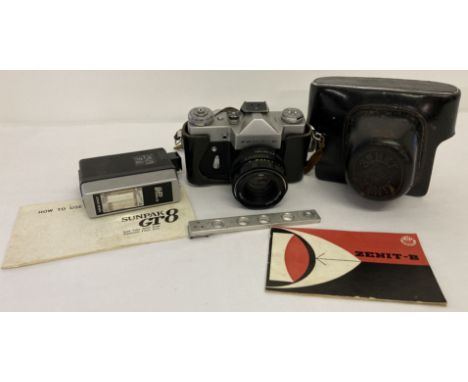 A Zenit B camera with Helios 44M lens, Sunpac GT8 flash and leather case. Complete with instructions for Senit camera and Sun