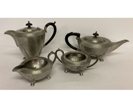 A vintage Civic Pewter 4 piece tea set with hammered design and wooden finials. Teapot, hot water pot, milk jug and sugar bow