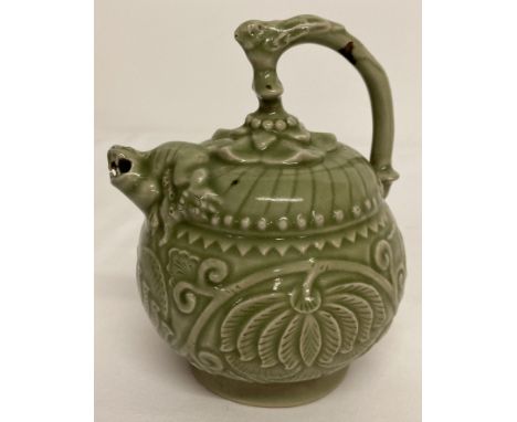 A Chinese Celadon glazed Yaozhou "backflow" teapot. With tiger detail to spout and bird shaped handle. Approx. 18cm tall.