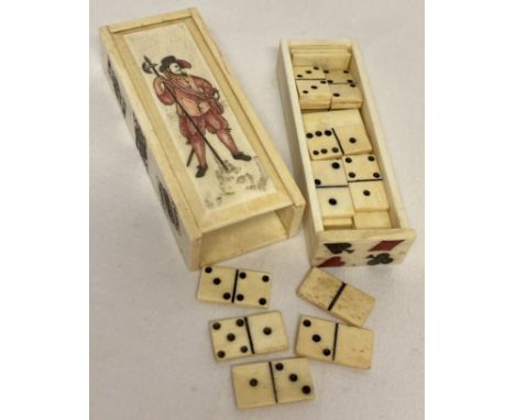 A carved bone miniature domino set with sliding drawer compartment. Box is carved with figural detail to the lid, playing car