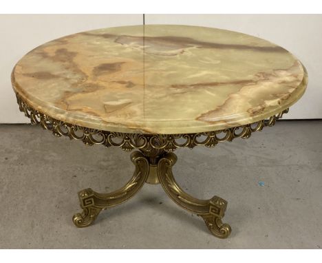 A vintage metal framed tripod footed coffee table with circular onyx top. Decorative galleried underside with central pedesta