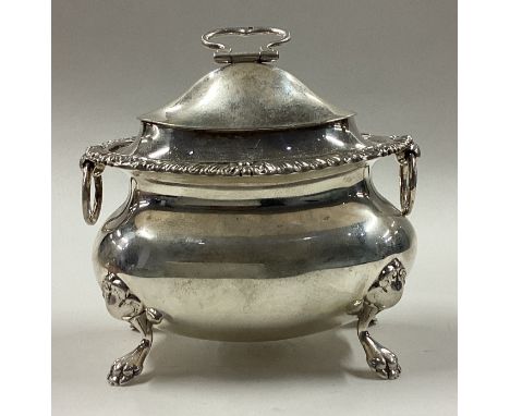 A silver tea caddy with handles. Fully marked to body and part marked to cover. Birmingham 1914. Approx. 166 grams. Est. £150