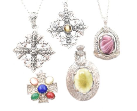 A collection of vintage Celtic jewellery. The lot to include two Celtic pendant necklaces strung on white tone metal chain ne