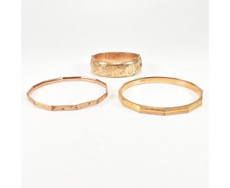 Three rolled gold bangles. The bangles to include a hinged 9ct 1/15 rolled gold hinged bangle. A rolled gold bangle with face