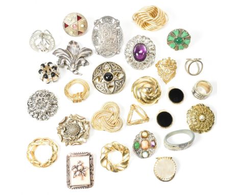 A collection of vintage and modern scarf clips and rings. The lot to include seventeen scarf clips and seven scarf rings. To 