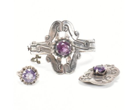 A collection of silver and synthetic colour changing sapphire jewellery. The collection to include a silver hinged bangle set