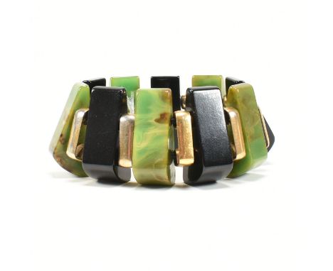 A 1930's Art Deco Bakelite wedge stretch link cuff bracelet. The bracelet bangle formed with marbled green and black Bakelite