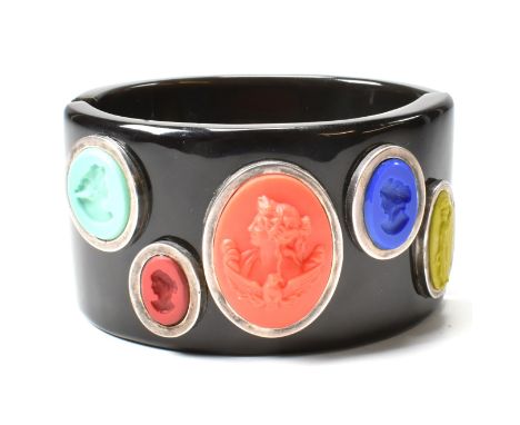 An Extasia buffalo horn hinged bangle with cameo and intaglio decoration. The contemporary designer hinged buffalo horn bangl