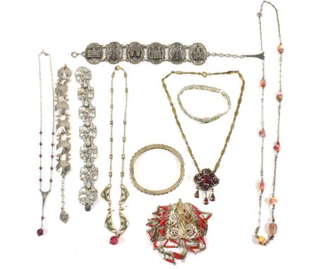A collection of vintage necklaces bracelets and bangle. The necklaces to include filigree, paste enamel work. The bracelets i