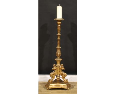 An 18th century style giltwood and gesso floor standing pricket candlestick, acanthus grasped fluted column, zoomorphic monop