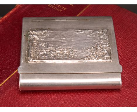 Pugilism - a 19th century silver coloured metal novelty snuff or tobacco box, the flush-hinged cover in relief with a boxing 