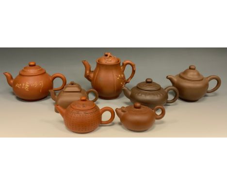 A Chinese Yixing melon shaped teapot, applied with blossoming prunus, 13.5cm high, seal mark; others (7) 
