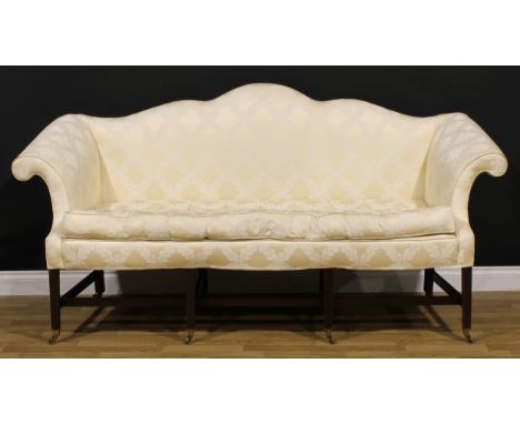 A Chippendale Revival double-peak camel back sofa, stuffed-over upholstery, outswept arms, squab cushion, tapered square fore