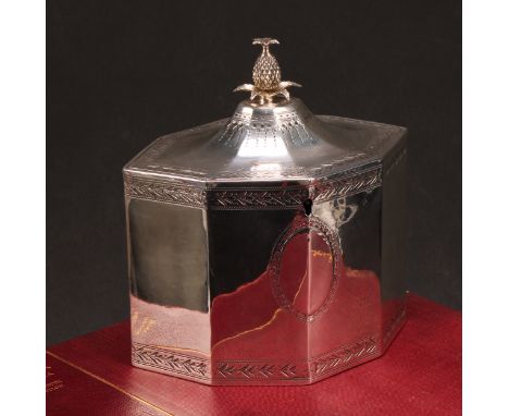 A George III silver octagonal tea caddy, flush-hinged cover with pineapple finial, bright-cut borders, 14cm wide,  Charles Ch