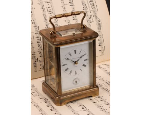 A large lacquered brass repeater carriage clock, 7cm enamel dial inscribed Matthew Norman, London, Roman numerals, alarm sett