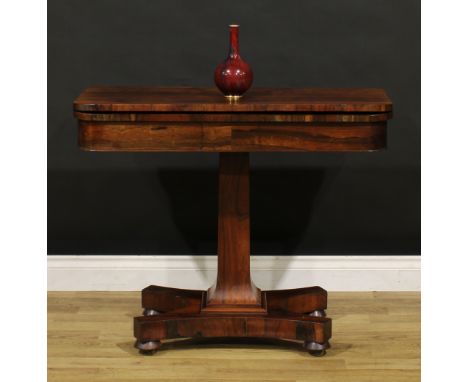A William IV rosewood card table, hinged top enclosing a baize lined playing surface, spreading square column, incurve rectan